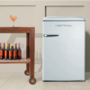 Mistral 117L Bar Fridge in white with bottles of wine on the left