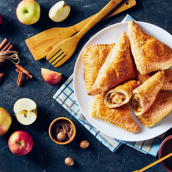 Apple,Turnover,On,A,White,Plate,On,A,Dark,Concrete